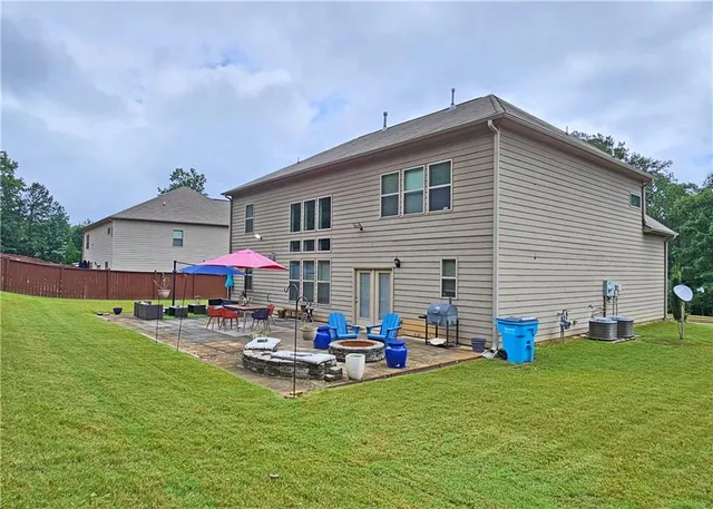 a front view of house with yard and outdoor seating