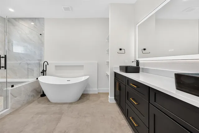 a white bath tub sitting in a bathroom