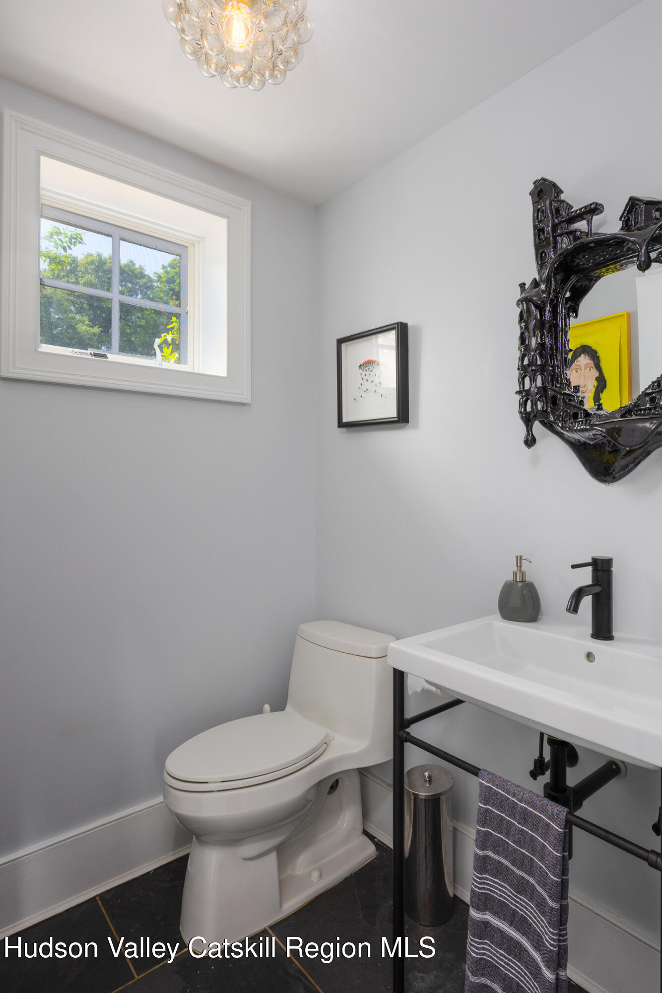 64 Dug Road Accord, NY 12404 - Photo 17 of 44 a white toilet sitting next to a bathroom sink