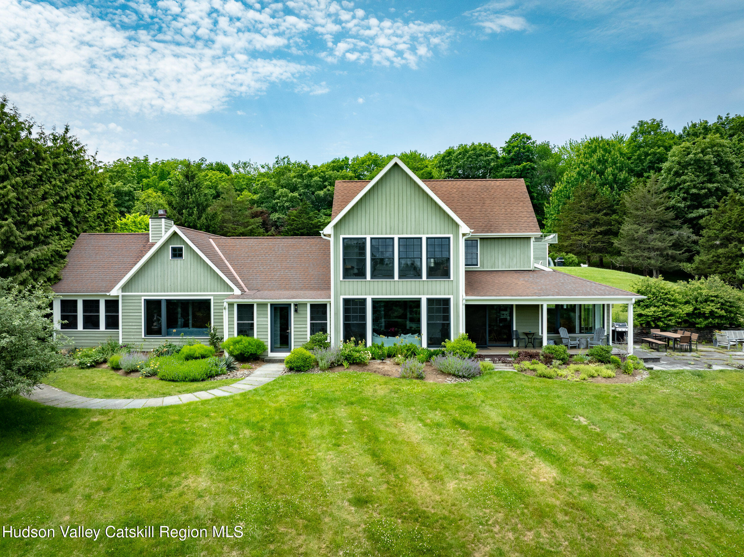 64 Dug Road Accord, NY 12404 - Photo 2 of 44 a front view of a house with a yard table and chairs