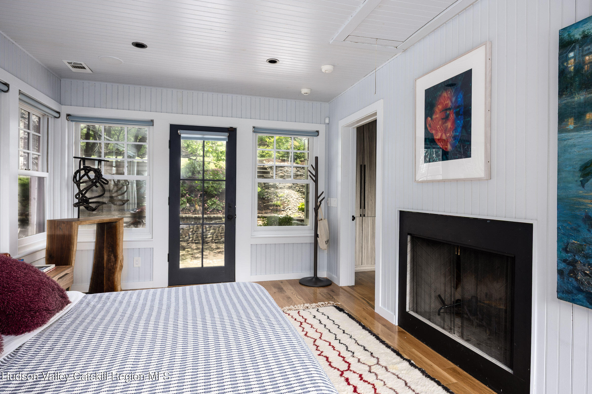 64 Dug Road Accord, NY 12404 - Photo 21 of 44 a bedroom with a bed and a fireplace