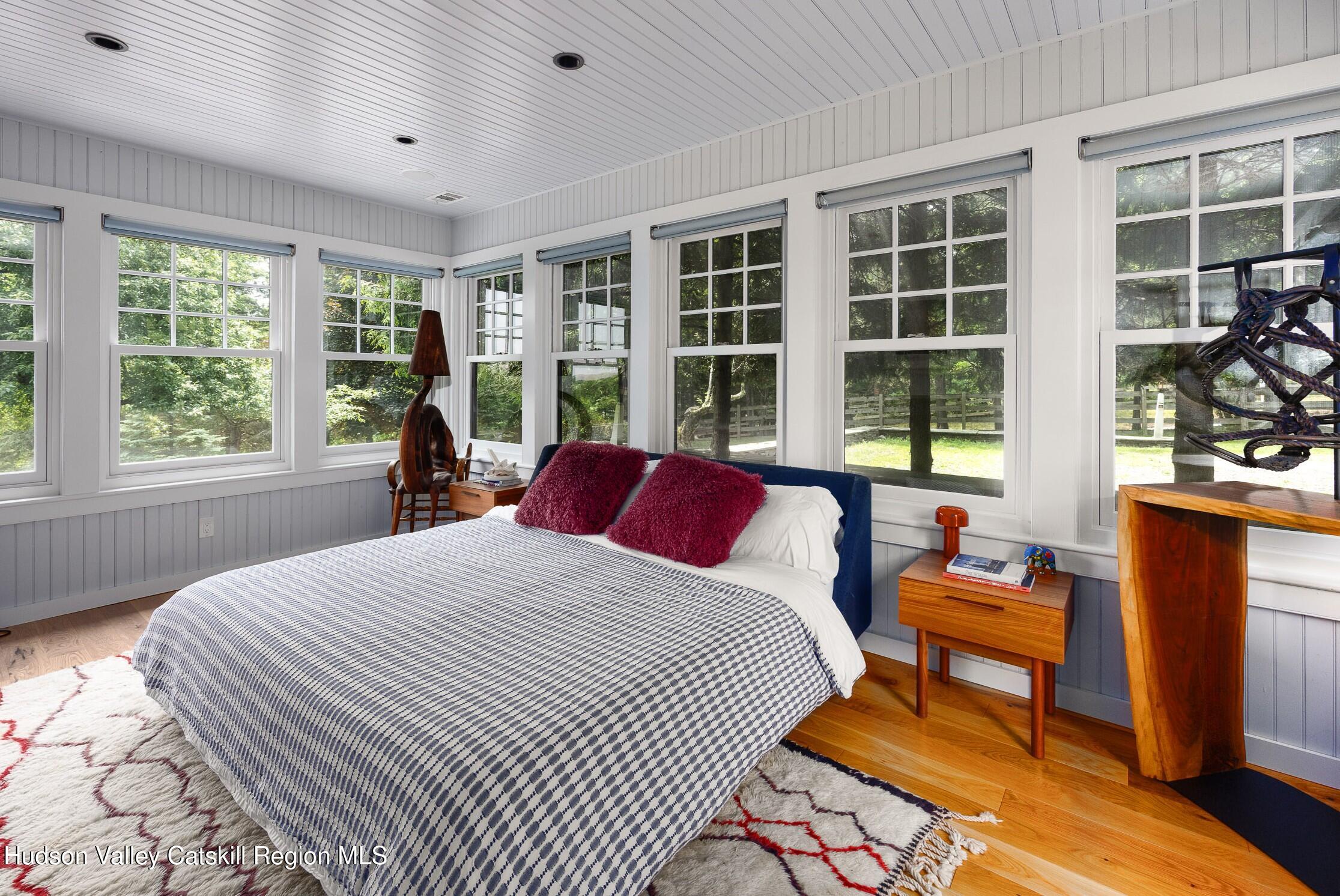 64 Dug Road Accord, NY 12404 - Photo 22 of 44 a bedroom with a bed and wooden floor