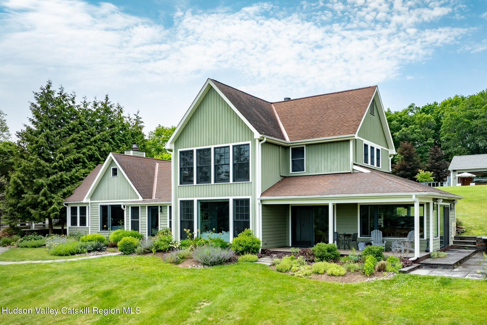 64 Dug Road Accord, NY 12404 - Photo 5 of 44 a front view of a house with porch and garden