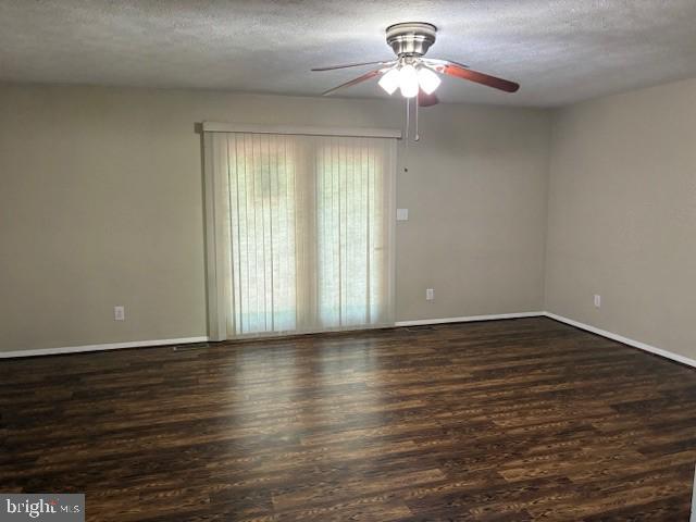 206 Calvert Drive Lusby, MD 20657 - Photo 11 of 32 a view of an empty room with wooden floor and a window