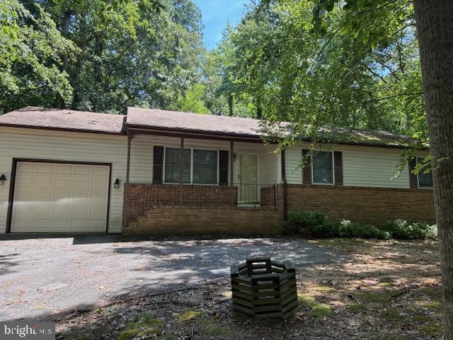 206 Calvert Drive Lusby, MD 20657 - Photo 2 of 32 a front view of a house with plants