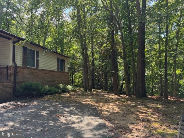 206 Calvert Drive Lusby, MD 20657 - Photo 30 of 32 a view of backyard with green space