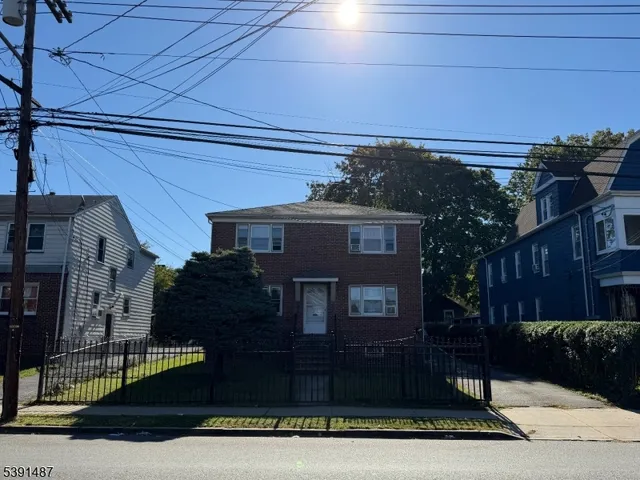 a view of a house with a street