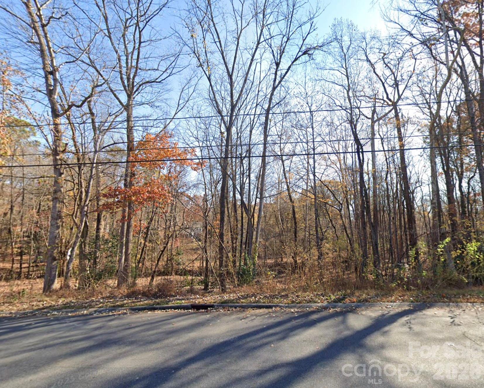 a view of a pathway of a road with a house