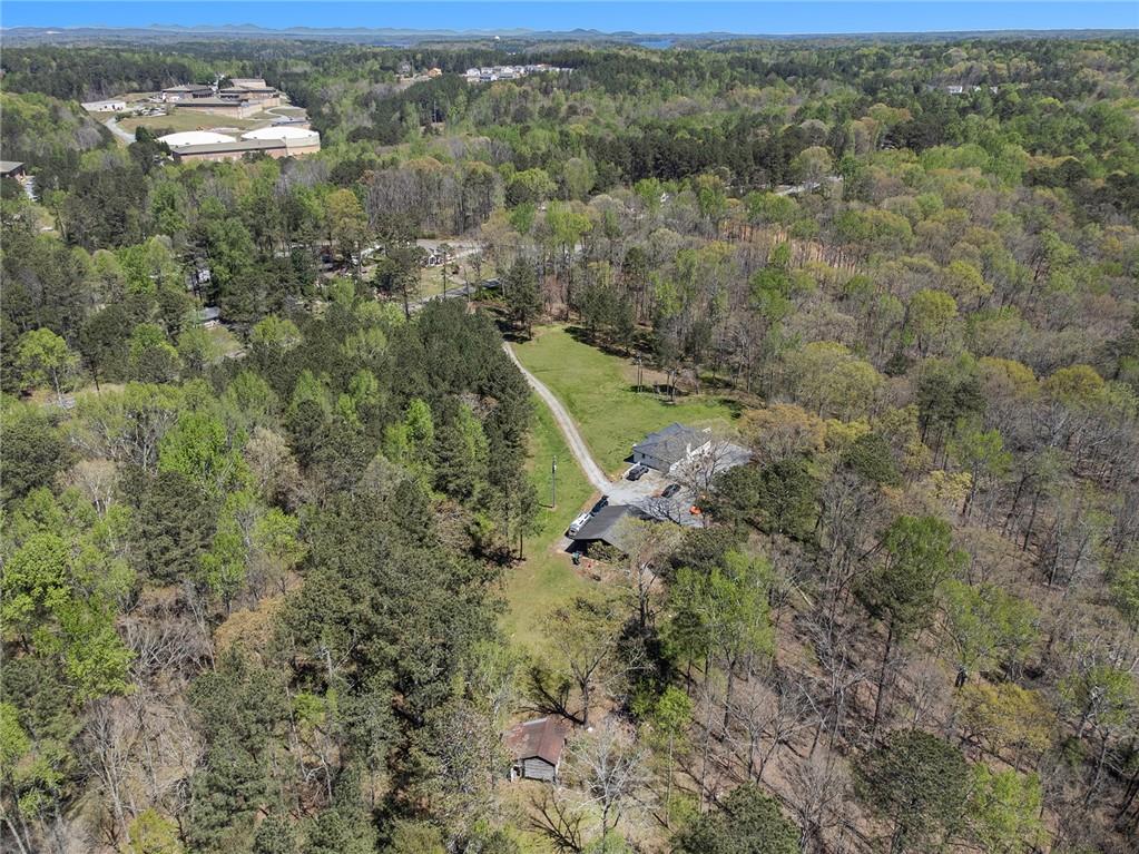 1585 Jimmy Dodd Road Buford, GA 30518 - Photo 11 of 30 a view of a forest with a street