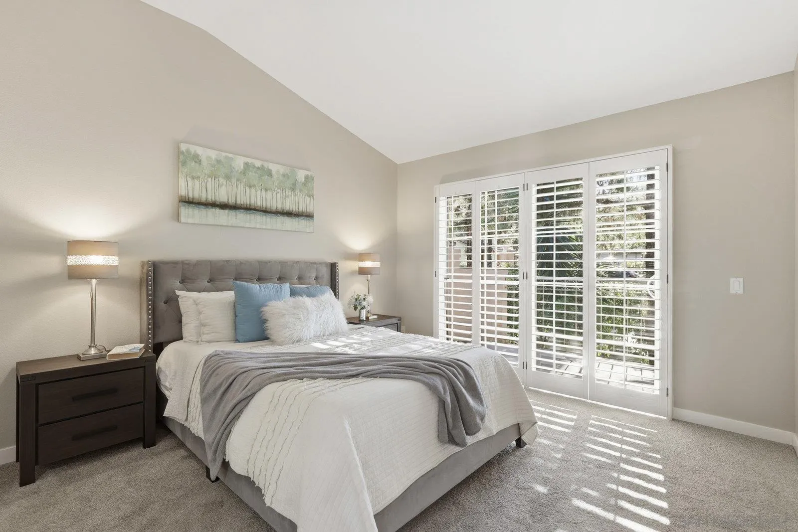 11908 Tivoli Park Row, Unit 7 San Diego, CA 92128 - Photo 15 of 34 a spacious bedroom with a bed and a window