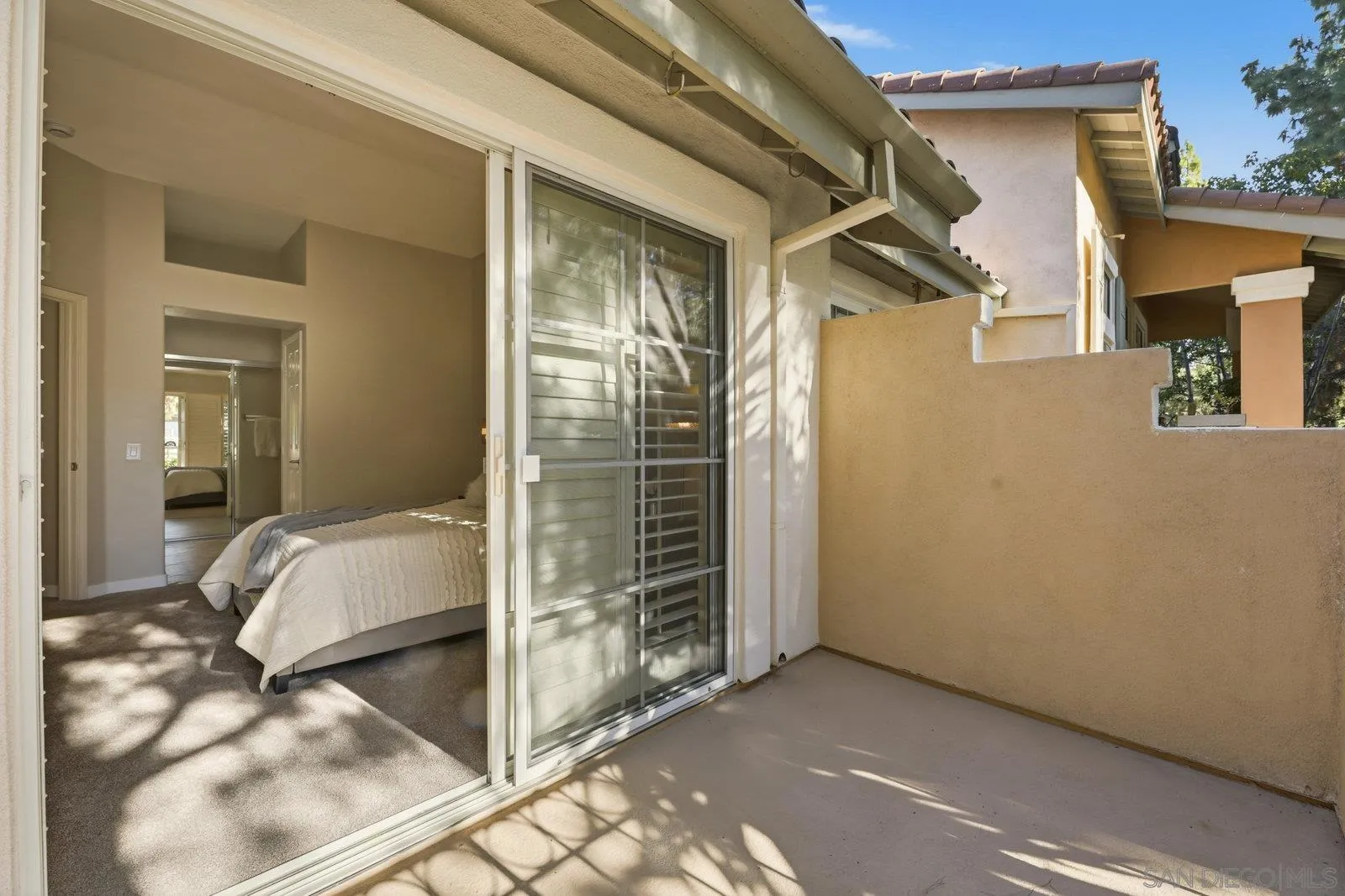 11908 Tivoli Park Row, Unit 7 San Diego, CA 92128 - Photo 16 of 34 a view of bedroom with balcony