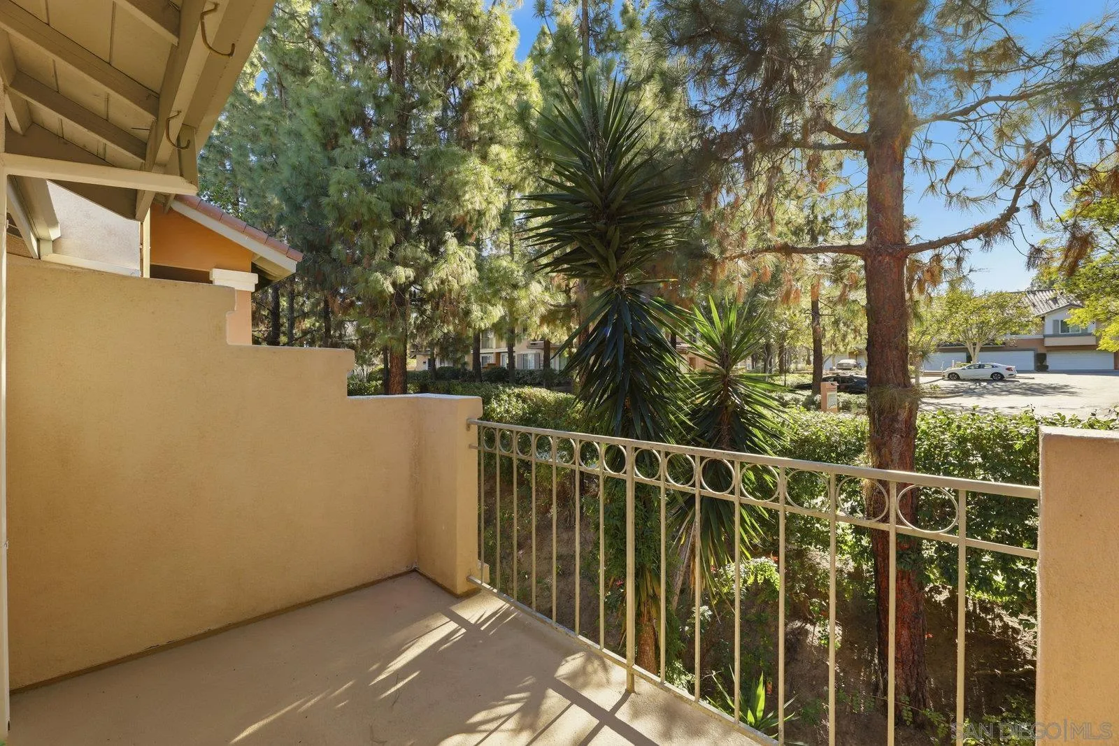 11908 Tivoli Park Row, Unit 7 San Diego, CA 92128 - Photo 17 of 34 a view of a deck with a forest