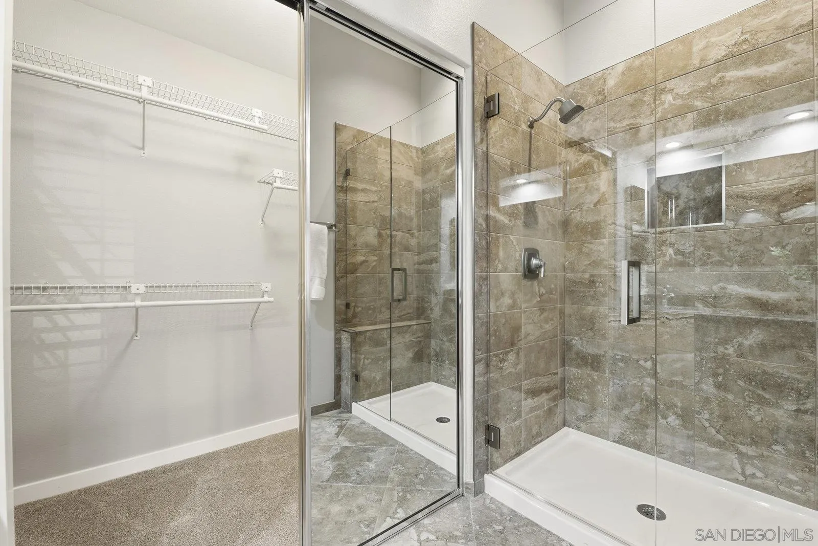 11908 Tivoli Park Row, Unit 7 San Diego, CA 92128 - Photo 23 of 34 a bathroom with a shower and a sink