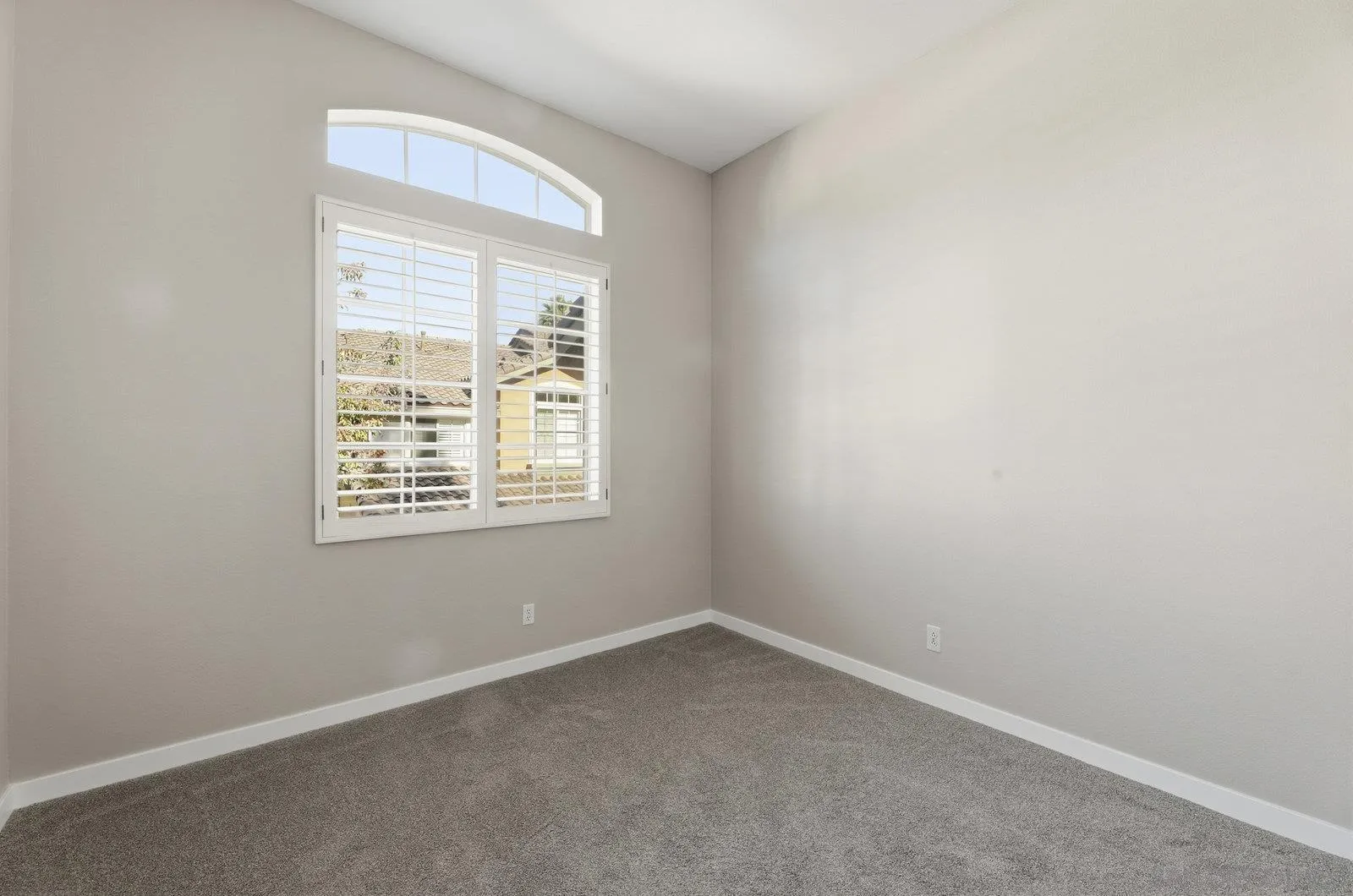 11908 Tivoli Park Row, Unit 7 San Diego, CA 92128 - Photo 26 of 34 an empty room with a window