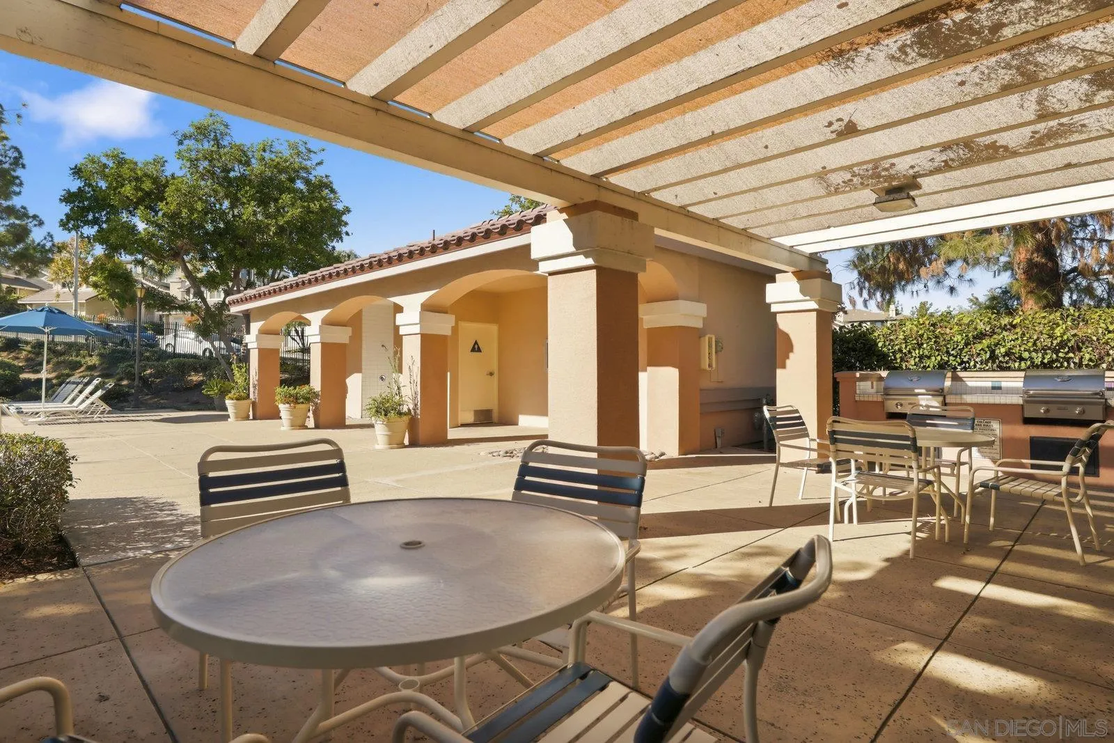 11908 Tivoli Park Row, Unit 7 San Diego, CA 92128 - Photo 31 of 34 a front view of a building with outdoor seating