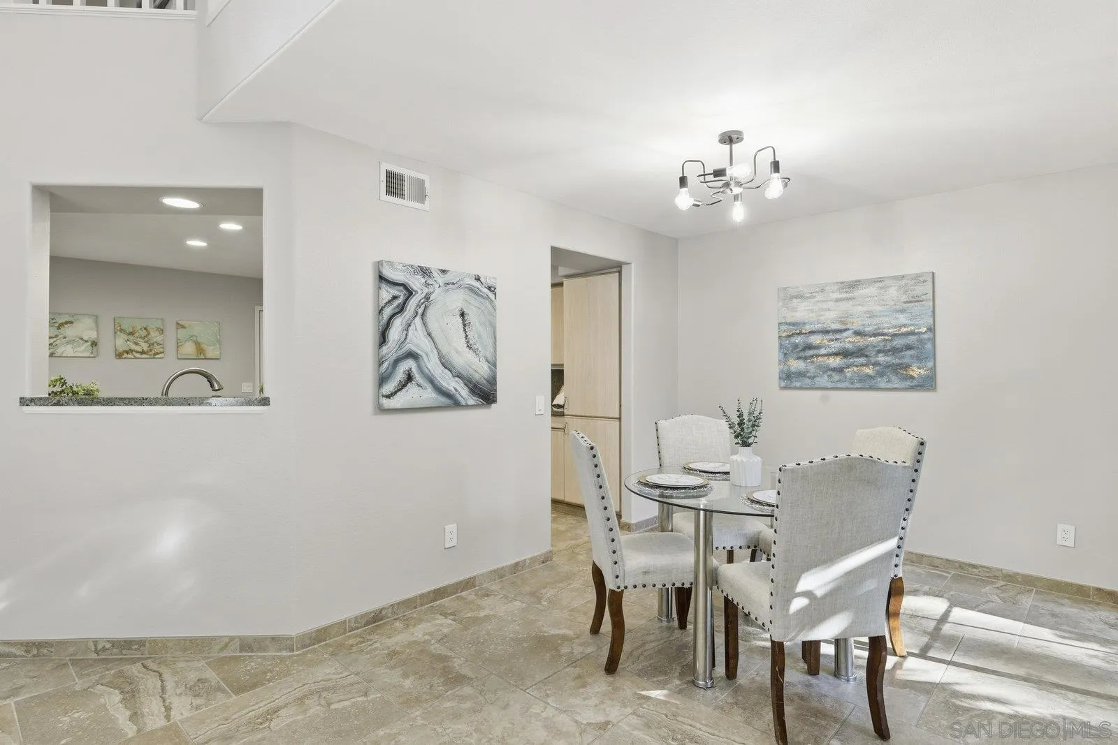 11908 Tivoli Park Row, Unit 7 San Diego, CA 92128 - Photo 9 of 34 a view of a dining room with furniture
