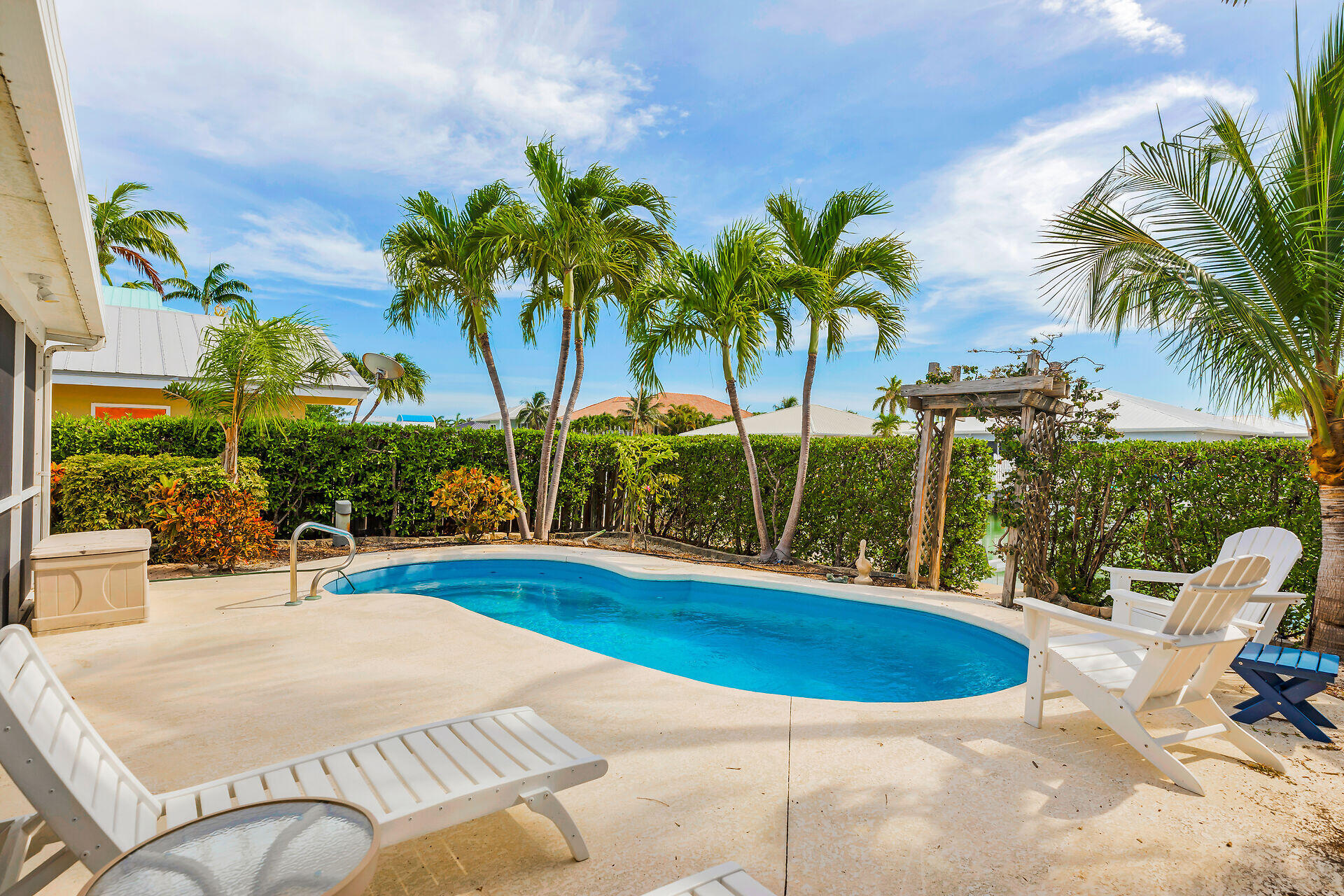351 5th Street Key Colony Beach, FL 33051 - Photo 36 of 43 Lounging Poolside