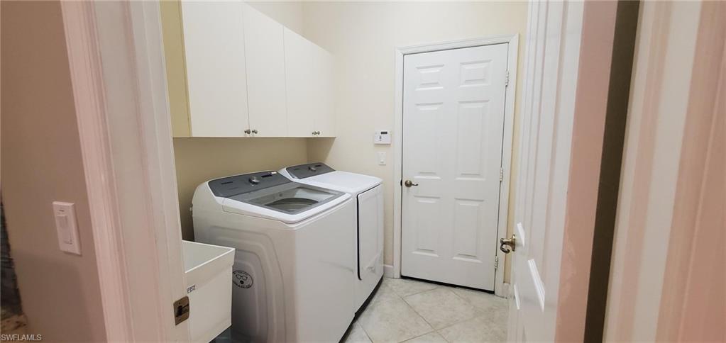 7855 Founders Circle Naples, FL 34104 - Photo 10 of 15 Laundry Room connects 2 car Garage and Kitchen