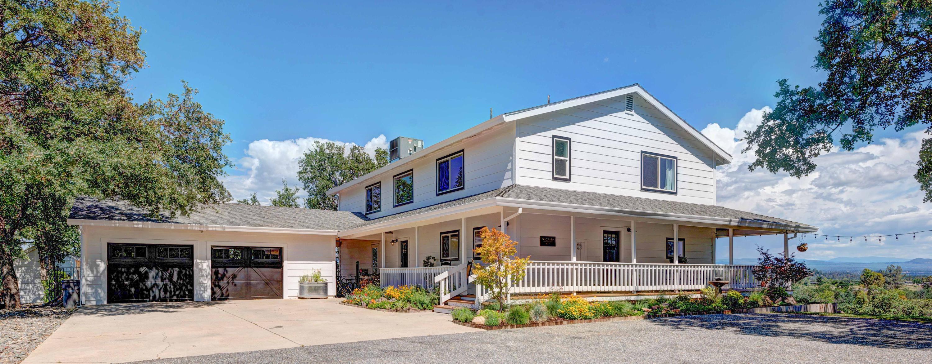 a front view of a house with garden