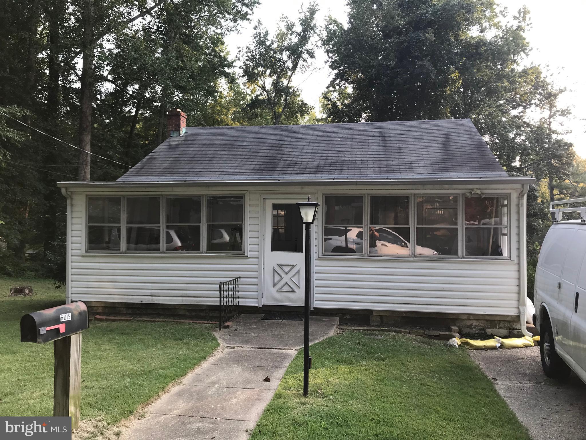 6019 Fir Road St. Leonard, MD 20685 - Photo 1 of 1 a front view of a house with garden
