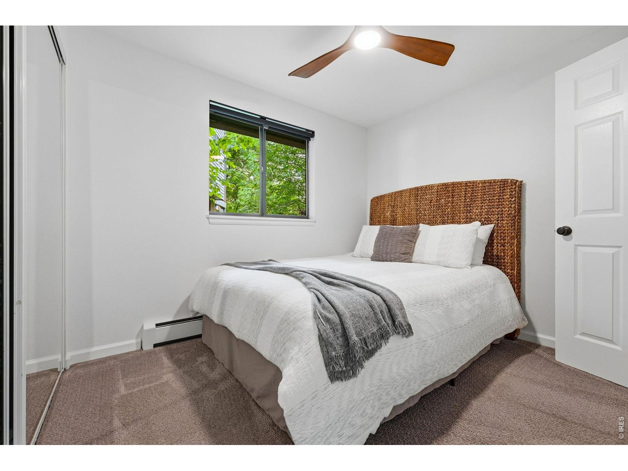 910 Portland Place, Unit 2 Boulder, CO 80304 - Photo 6 of 18 a bedroom with a bed and a window