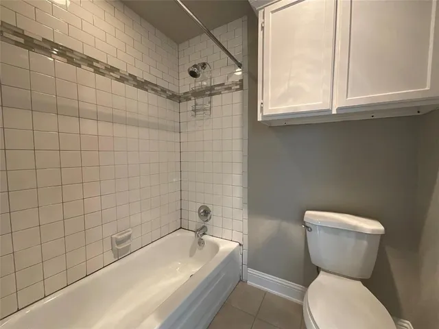 a bathroom with a toilet sink and bathtub