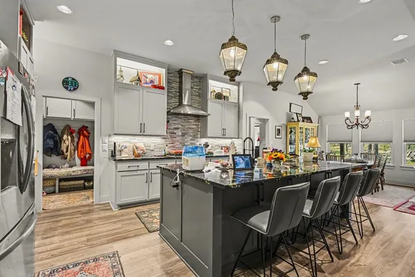 a view of a dining room and kitchen with a table chairs in it