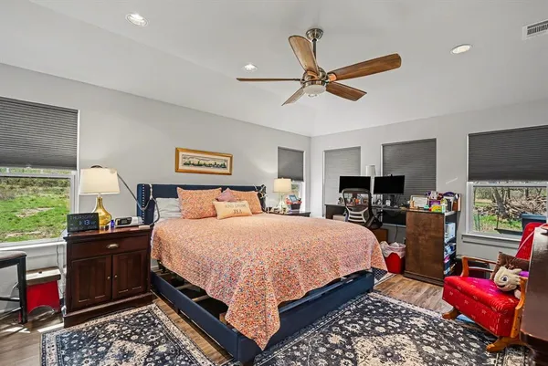 a bedroom with a bed and dresser