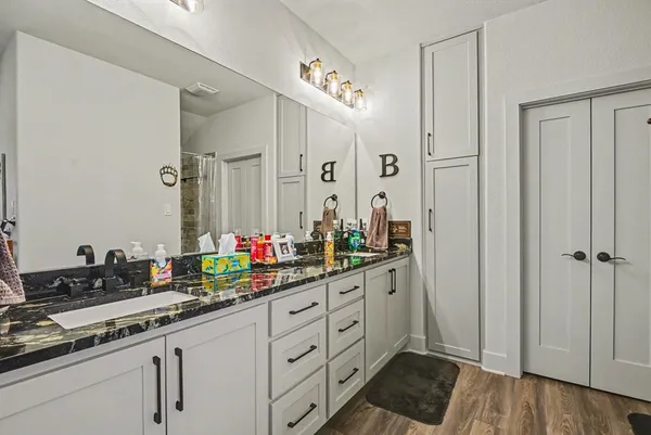a bathroom with a sink and a window