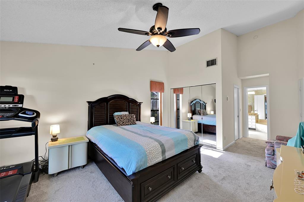 7312 Northwest 83rd Way Tamarac, FL 33321 - Photo 11 of 21 a bedroom with a bed and a chandelier