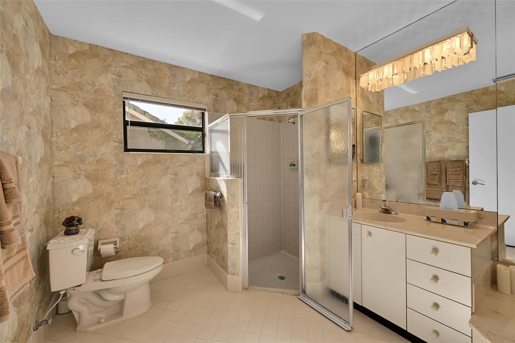 7312 Northwest 83rd Way Tamarac, FL 33321 - Photo 13 of 21 a bathroom with a toilet sink and shower