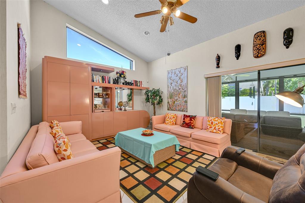 7312 Northwest 83rd Way Tamarac, FL 33321 - Photo 9 of 21 a living room with furniture and a large window