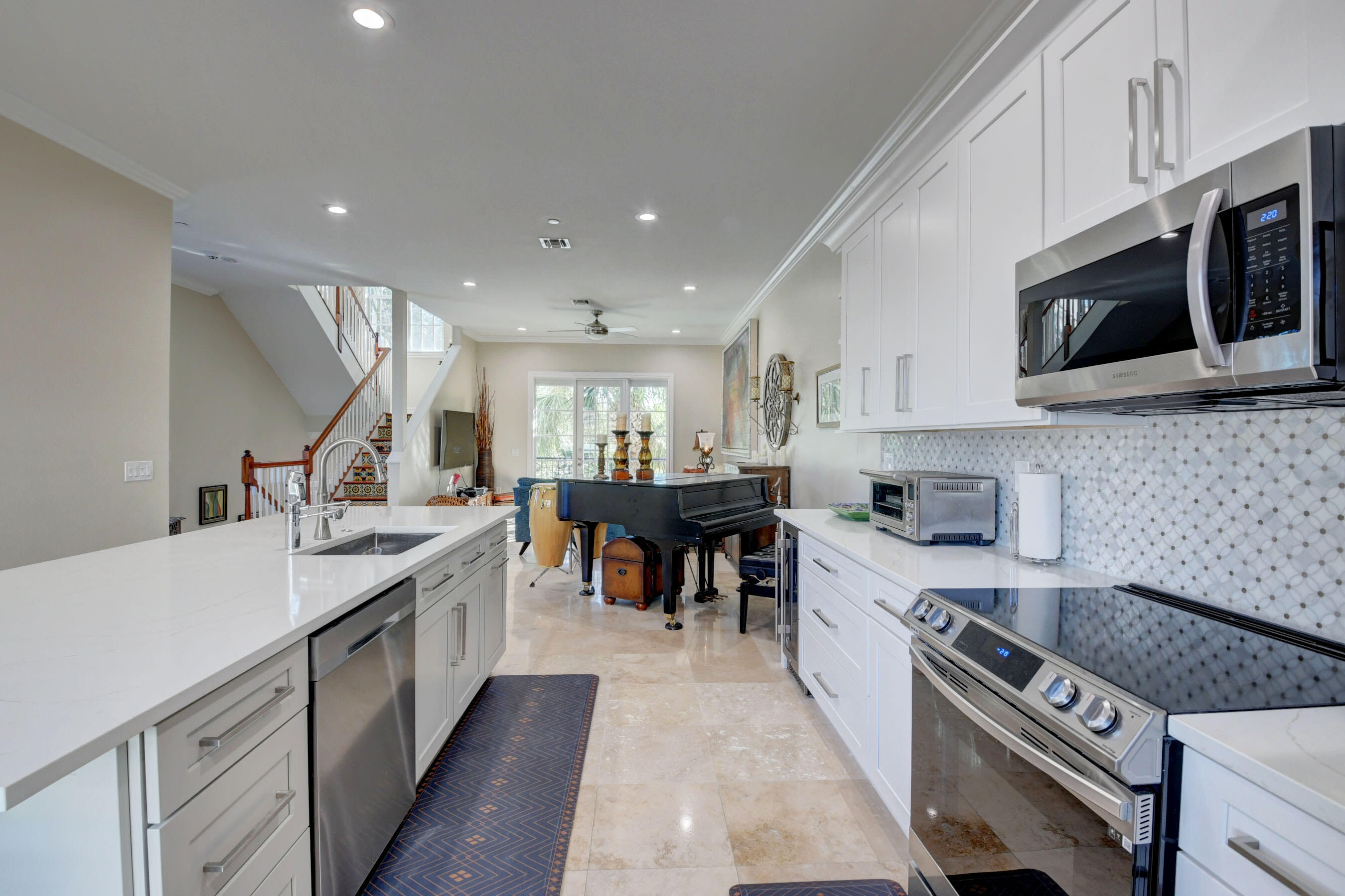 618 Renaissance Way Delray Beach, FL 33483 - Photo 7 of 27 Renaissance Pic Kitchen into living view