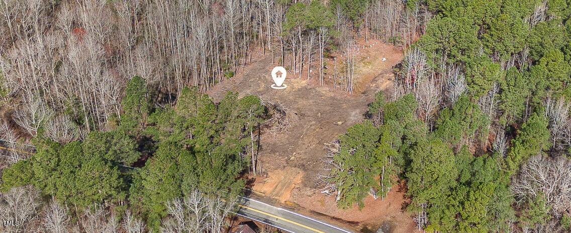 6905 Buck Road Wendell, NC 27591 - Photo 1 of 15 a backyard of a house with lots of green space and trees