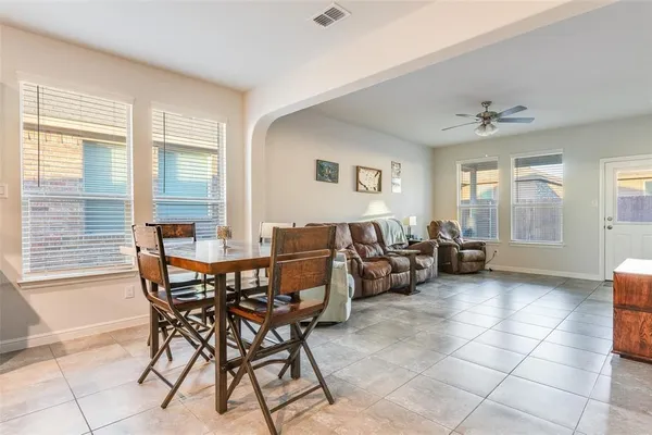 a view of a livingroom with furniture and a window