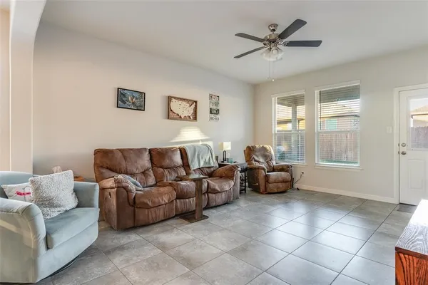 a living room with furniture and a large window