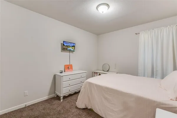 a room with a bed and a window