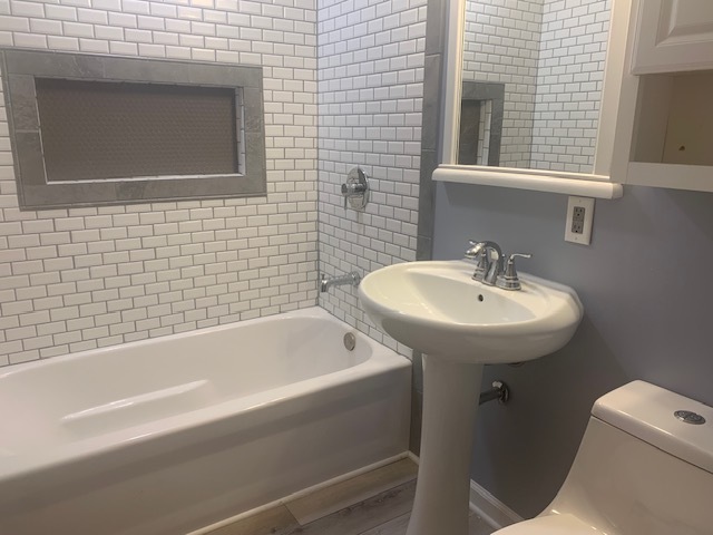 1818 Carr Street Streator, IL 61364 - Photo 16 of 45 a bathroom with a sink bathtub and toilet