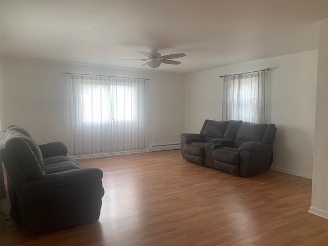 1818 Carr Street Streator, IL 61364 - Photo 17 of 45 a living room with furniture and a window