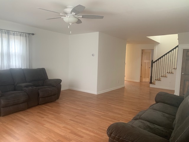 1818 Carr Street Streator, IL 61364 - Photo 18 of 45 a living room with furniture and a ceiling fan