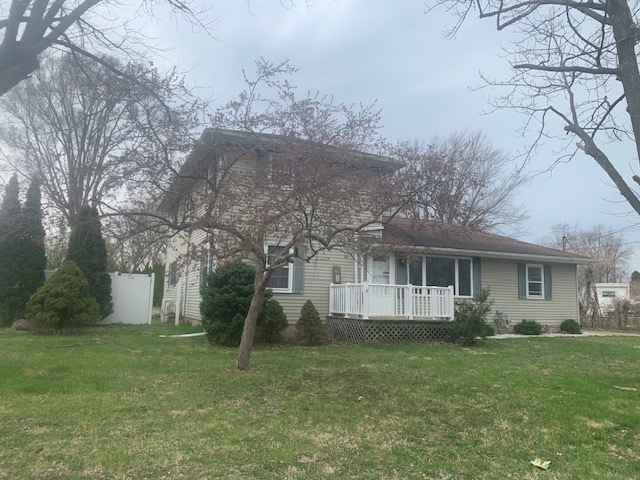 1818 Carr Street Streator, IL 61364 - Photo 3 of 45 a view of a house with backyard and a tree