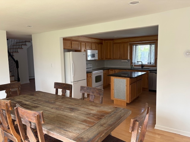 1818 Carr Street Streator, IL 61364 - Photo 43 of 45 a kitchen with kitchen island a sink stove and refrigerator