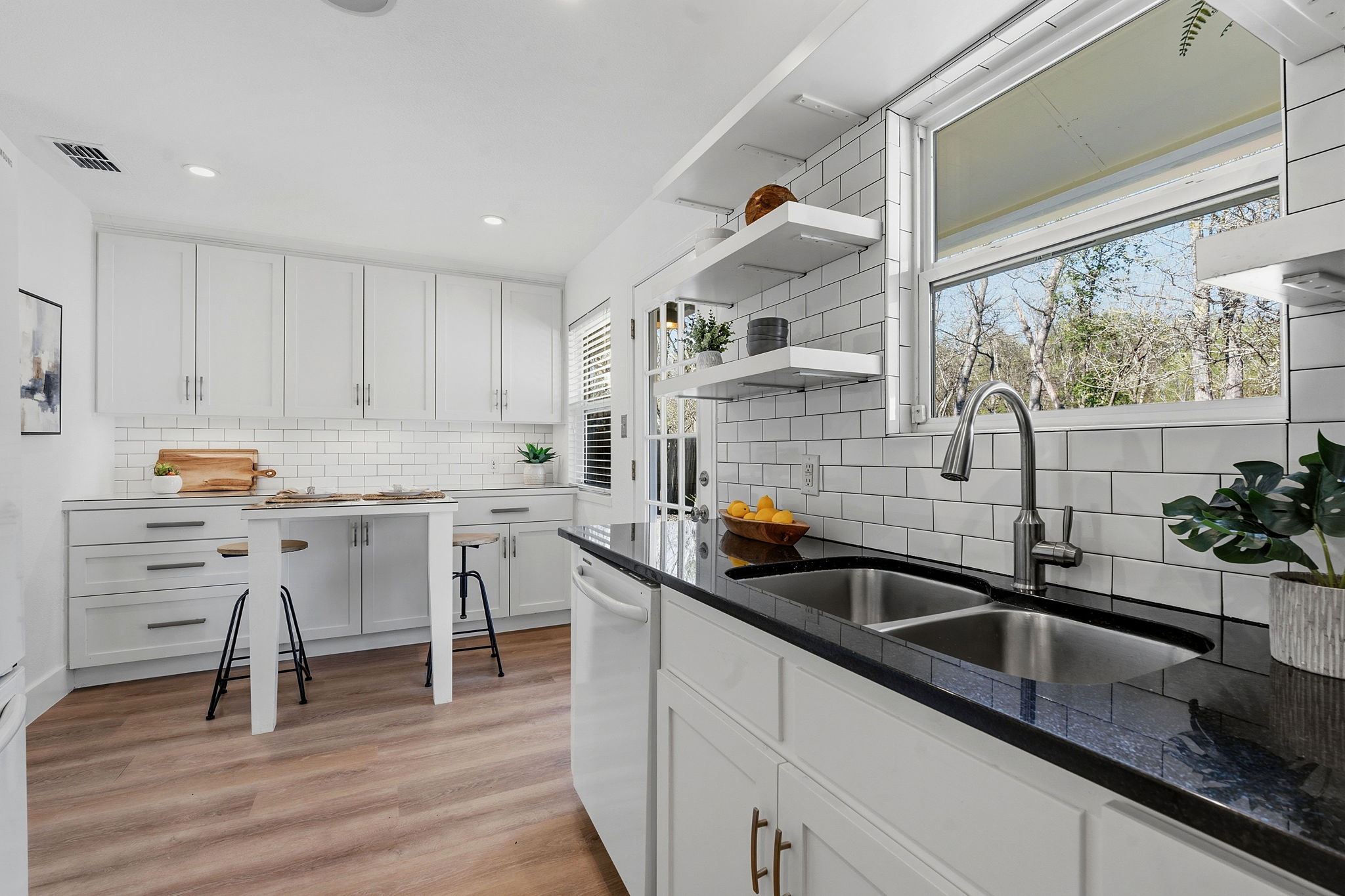1630 Chippeway Lane Austin, TX 78745 - Photo 18 of 28 Enjoy backyard views and natural light from the window over the kitchen sink.