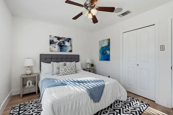 a bedroom with a bed and a window