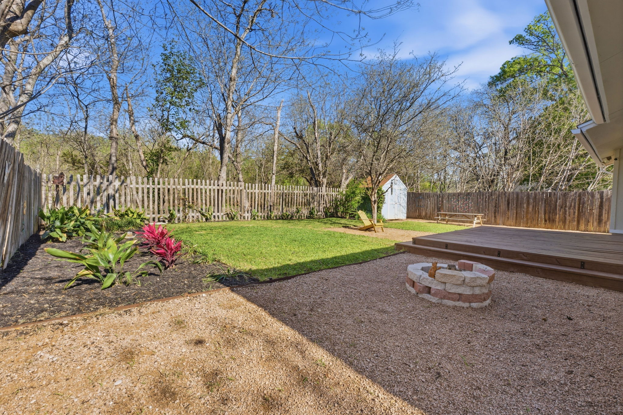 1630 Chippeway Lane Austin, TX 78745 - Photo 5 of 28 Gorgeous backyard oasis with a beautifully updated deck, strategic xeriscape patio areas, just the right amount of lawn, and a garden storage shed.