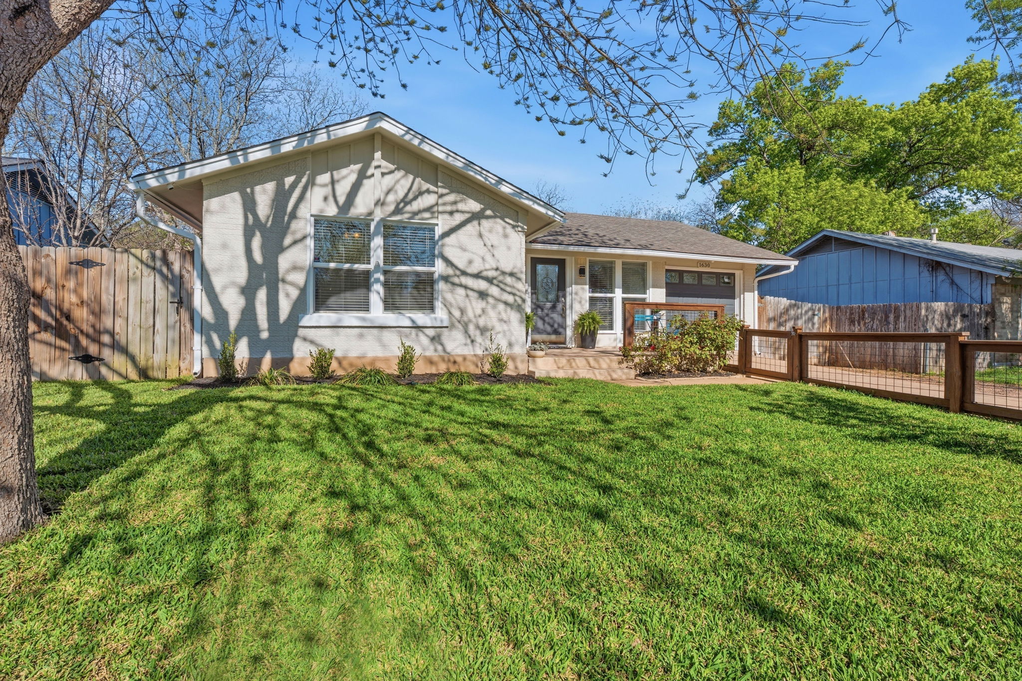 1630 Chippeway Lane Austin, TX 78745 - Photo 8 of 28 The fenced front and back yards provide room to spread out.
