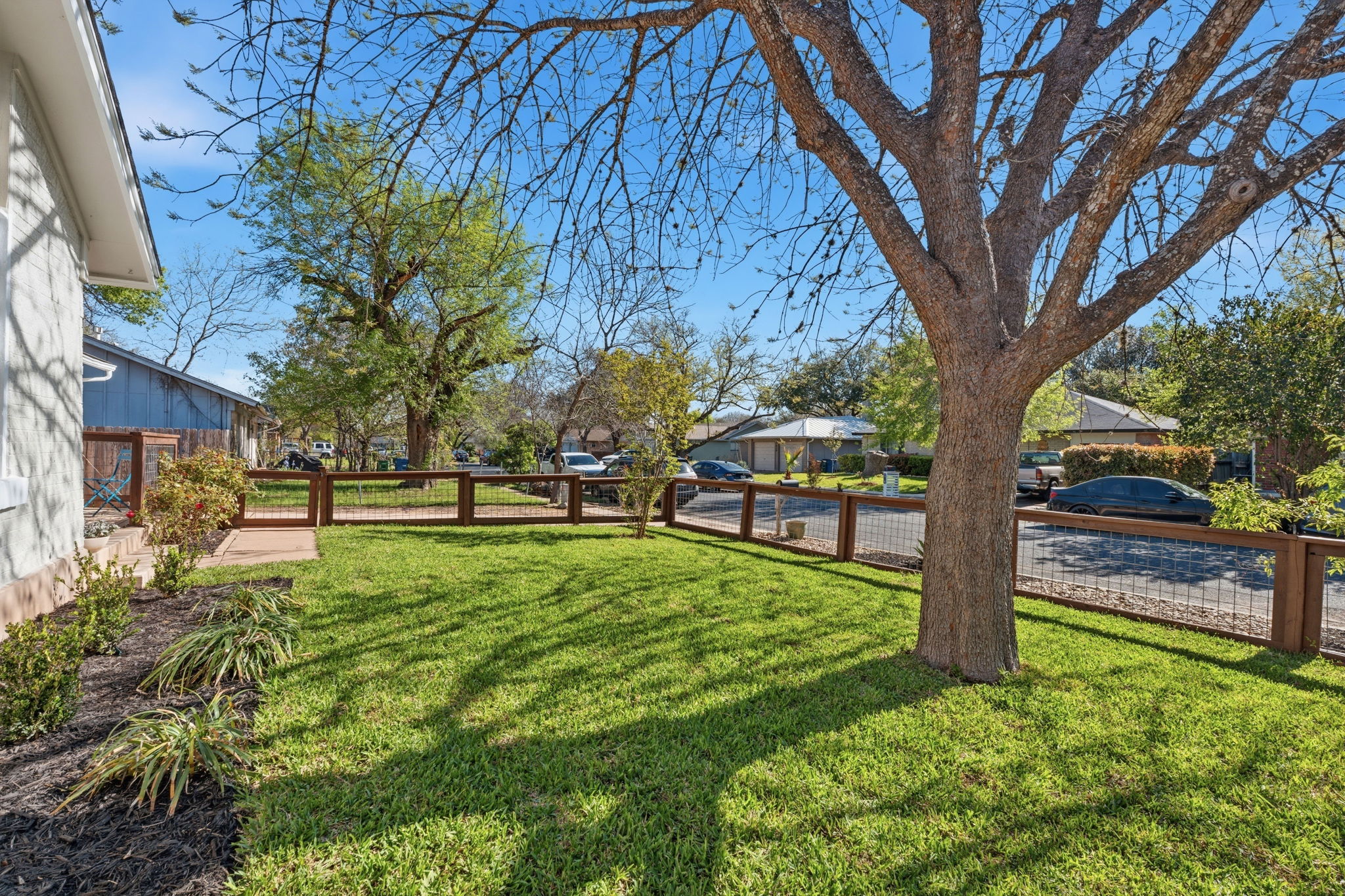 1630 Chippeway Lane Austin, TX 78745 - Photo 9 of 28 The fenced-in front yard offers a nice safe space for outdoor play with fencing that preserves the openness so you can still see neighbors waking by.
