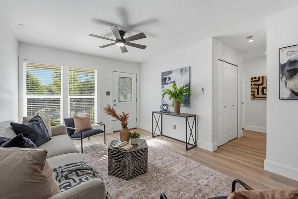 a living room with furniture and a large window