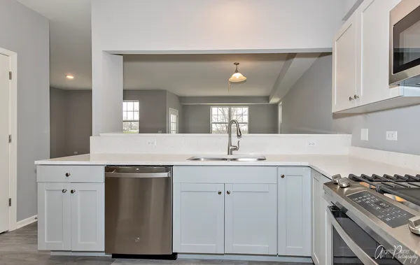 a kitchen with a sink and cabinets