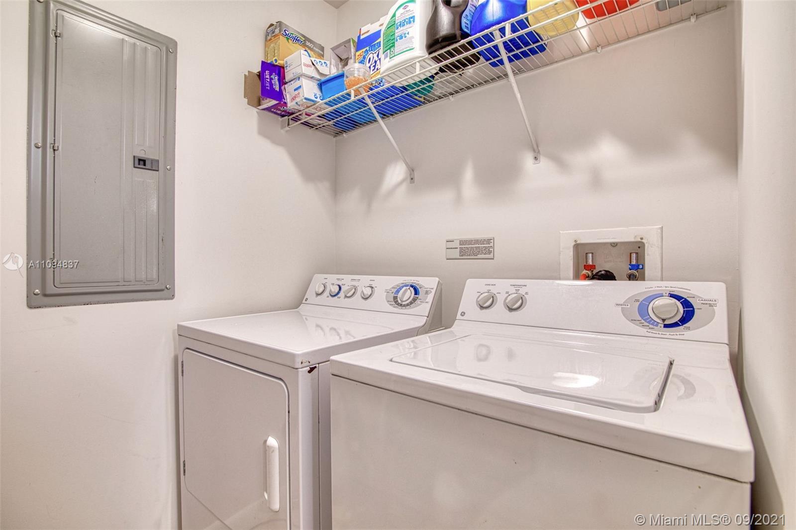 7355 Southwest 89th Street, Unit 425N Miami, FL 33156 - Photo 14 of 22 a utility room with dryer and washer